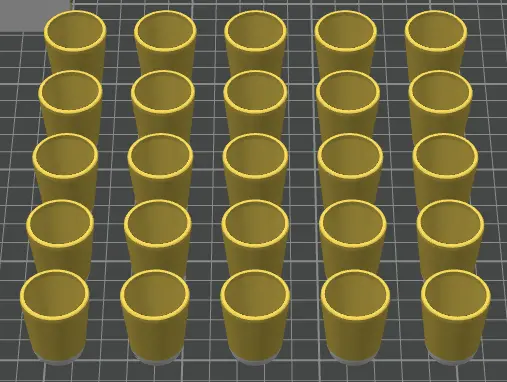 Multiple yellow cylindrical objects arranged in a grid on a black grid background