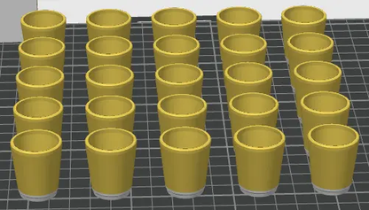 Multiple yellow cylindrical objects arranged in rows on a grid background