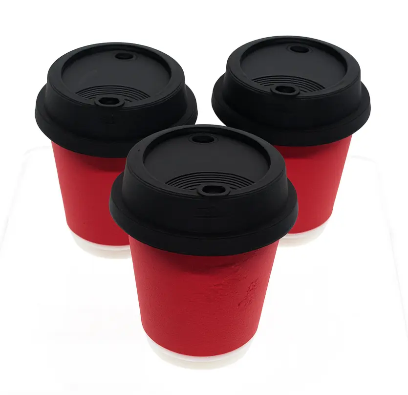 Three red cups with black lids on a white background