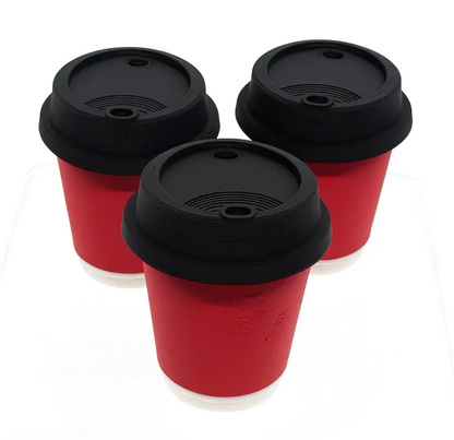 Three red cups with black lids on a white background