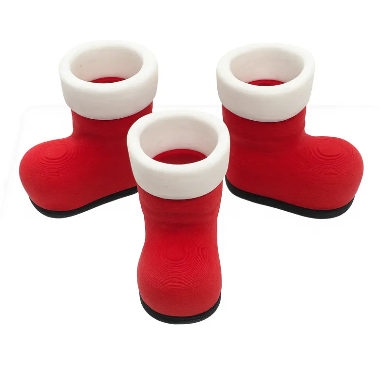 Red and white boots with black soles on a white background