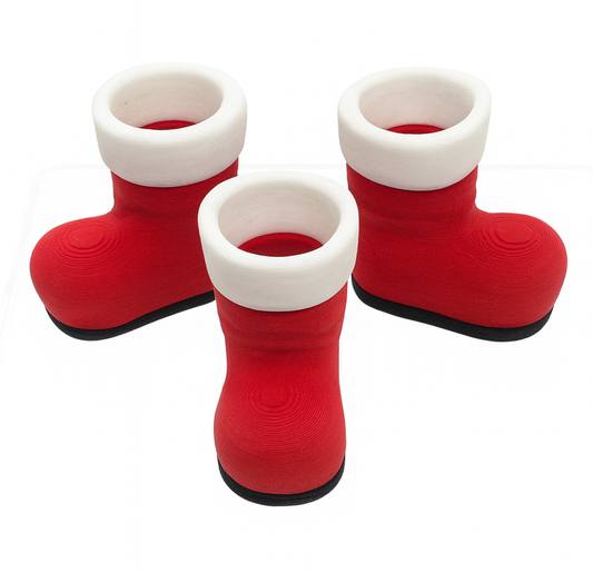 Red and white boots with black soles on a white background