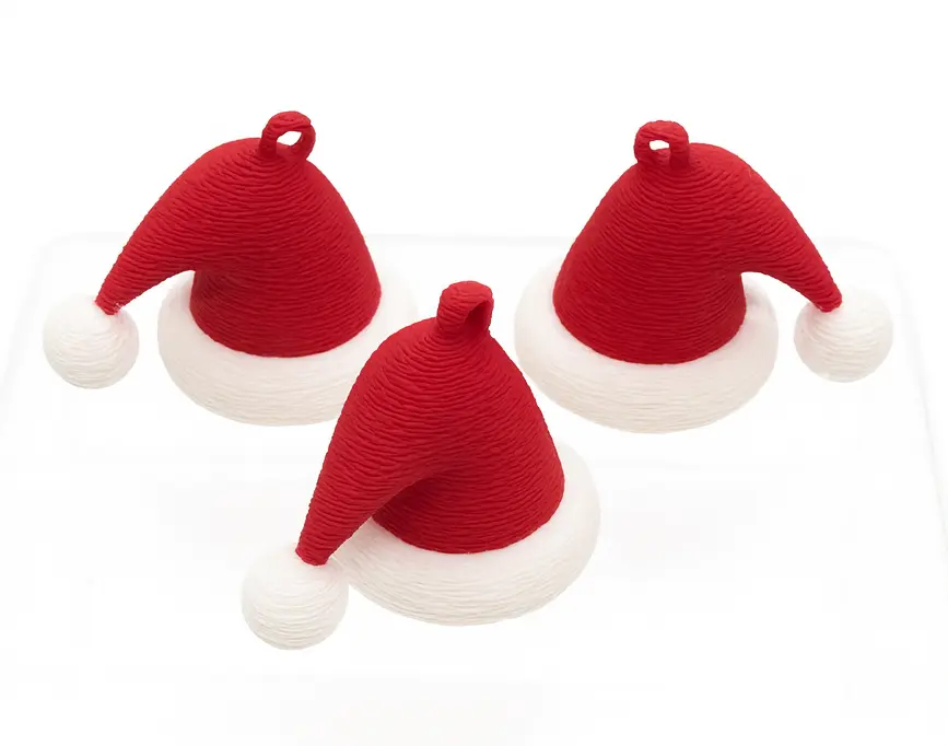 Three red and white Santa hats on a white background