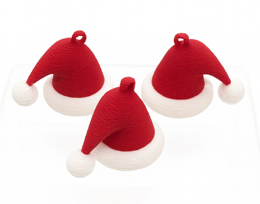 Three red and white Santa hats on a white background
