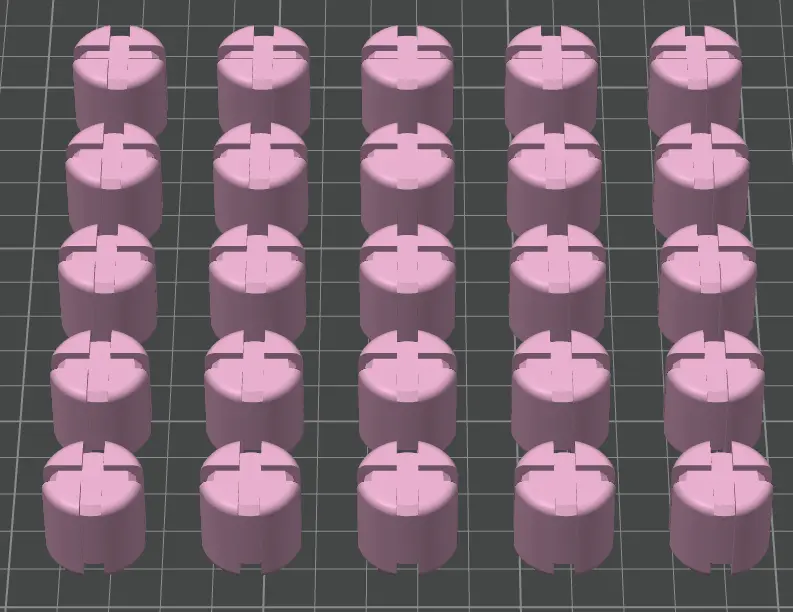 Multiple pink cylindrical objects with cutouts on a grid background