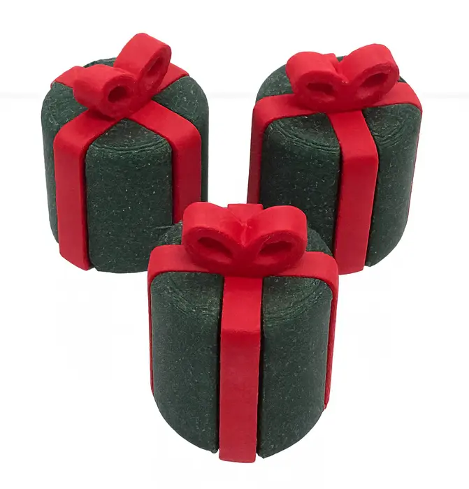 Three green gift boxes with red ribbons on a white background