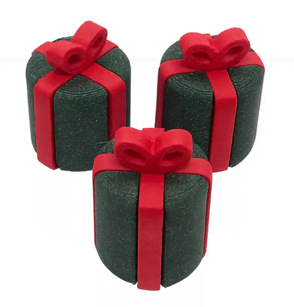 Three green gift boxes with red ribbons on a white background