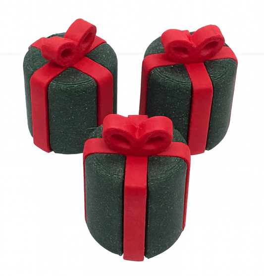 Three green gift boxes with red ribbons on a white background