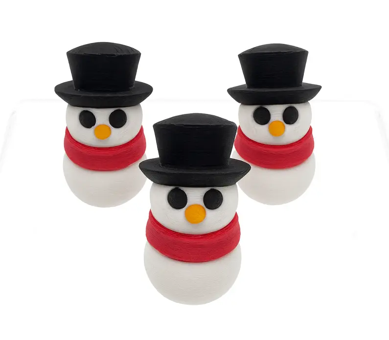 Three snowman-shaped objects with black top hats and red scarves on a white background